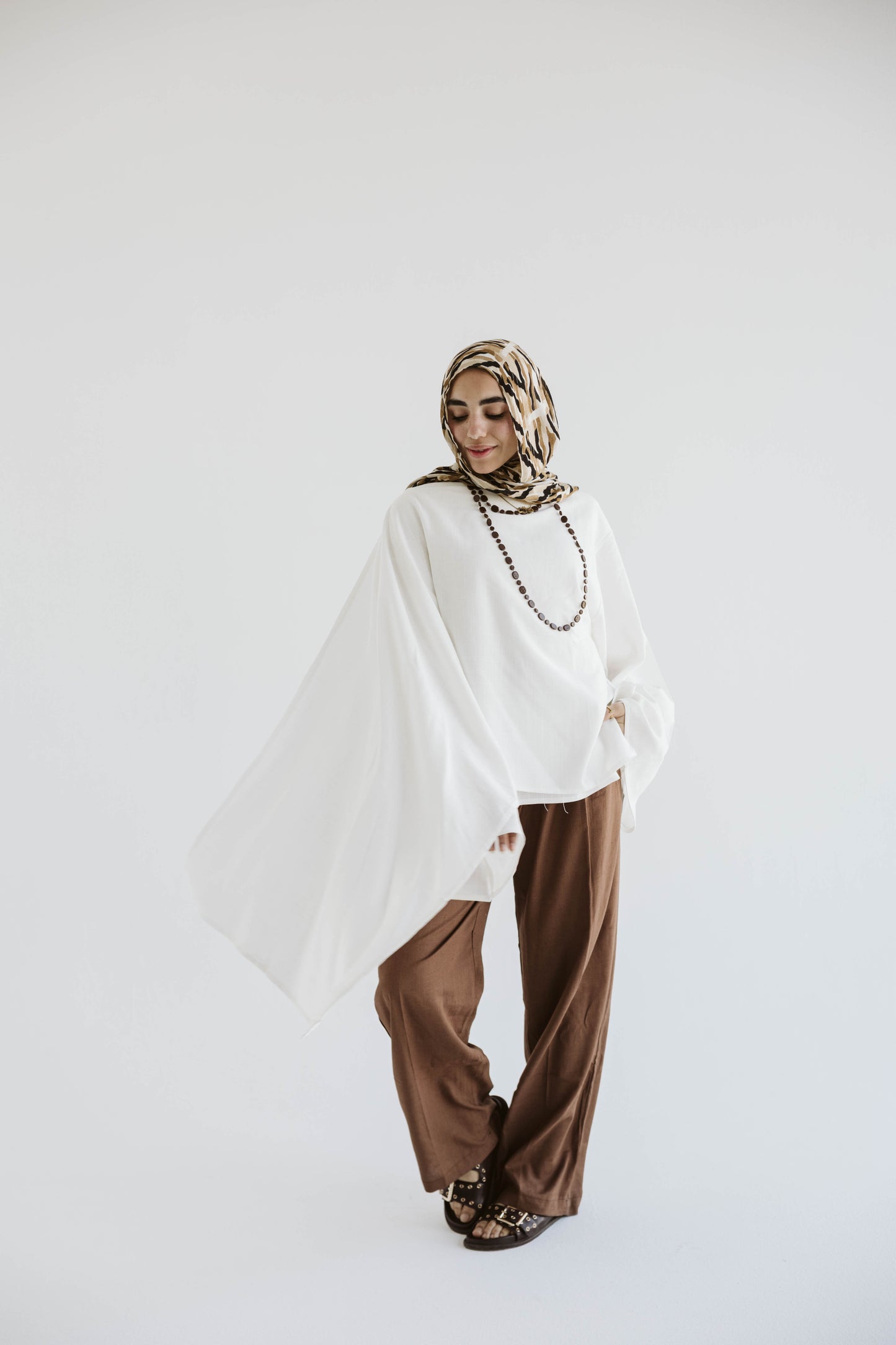 Minimalist White Asymmetrical Cape Top