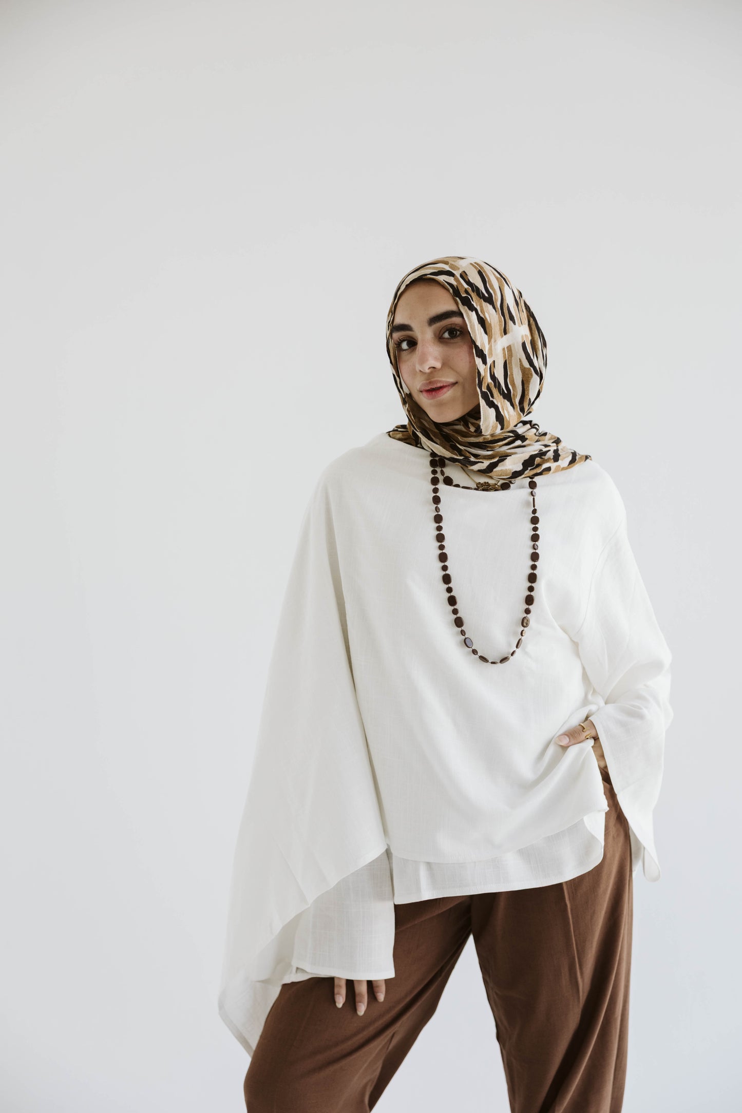 Minimalist White Asymmetrical Cape Top