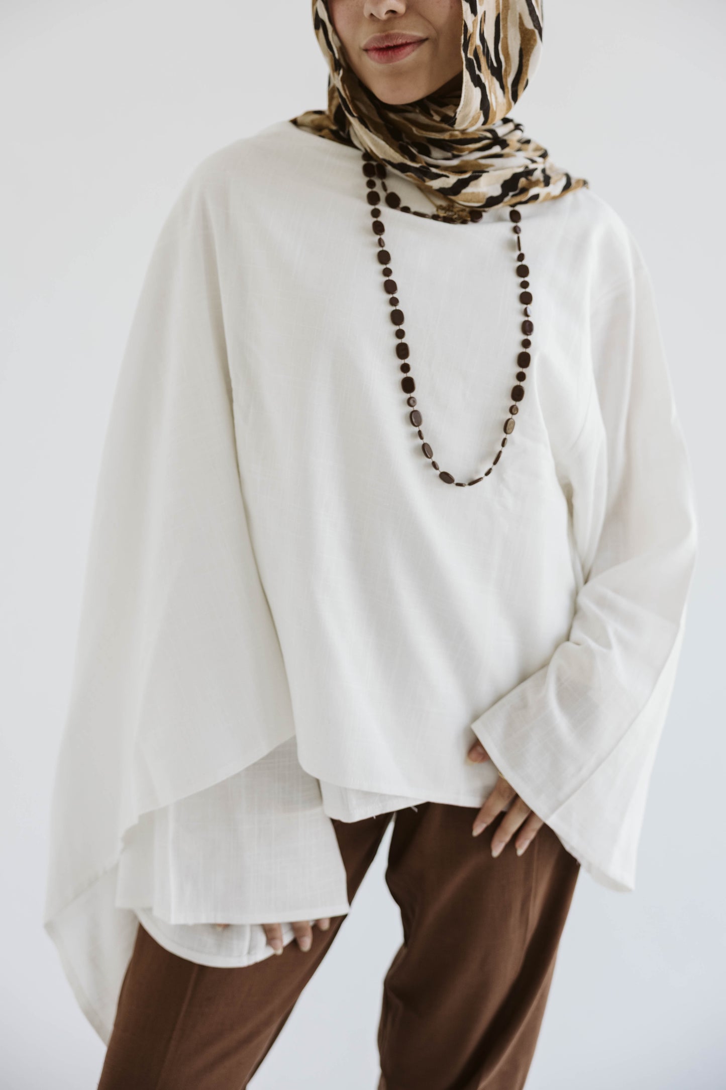 Minimalist White Asymmetrical Cape Top
