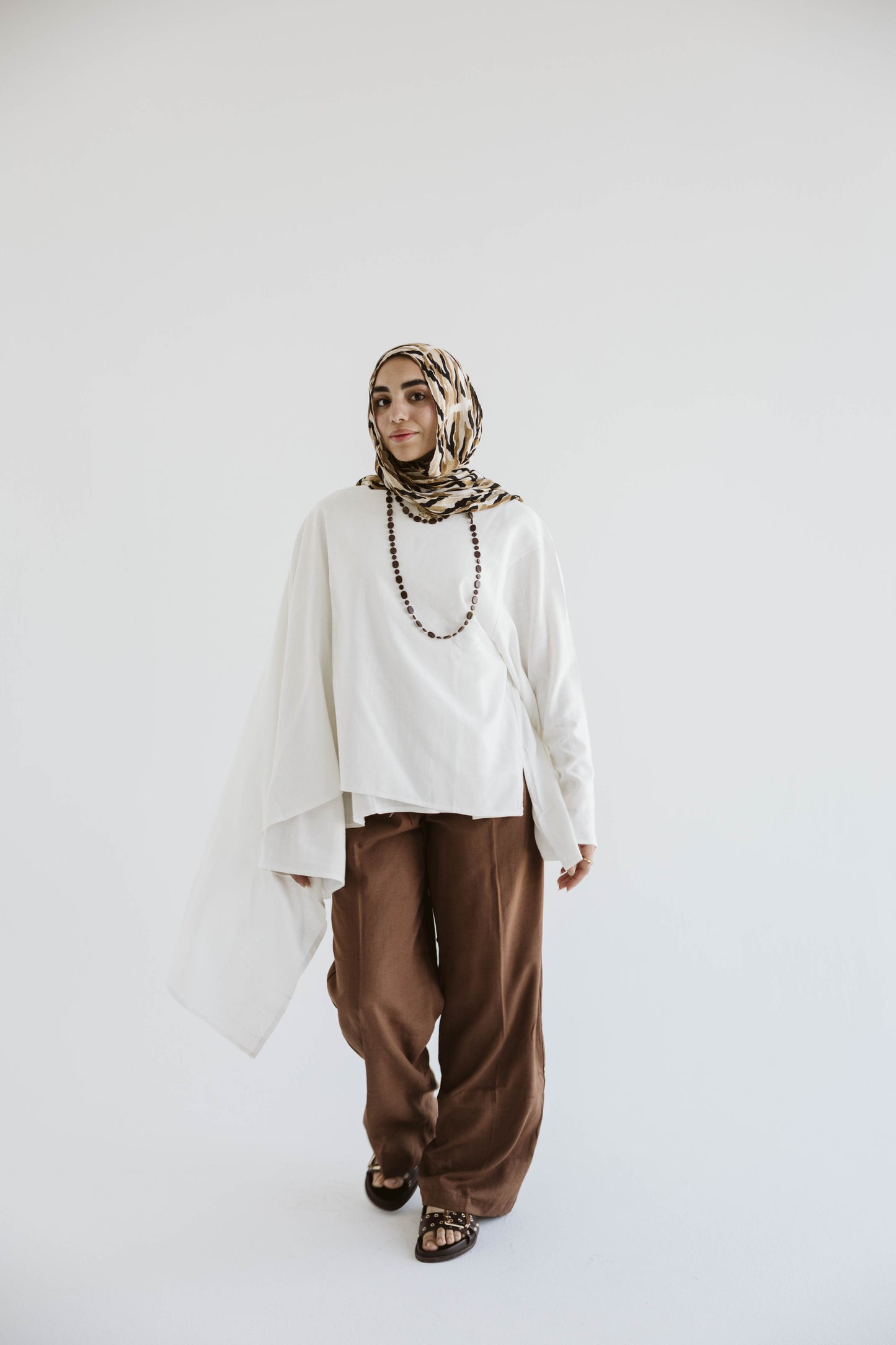 Minimalist White Asymmetrical Cape Top
