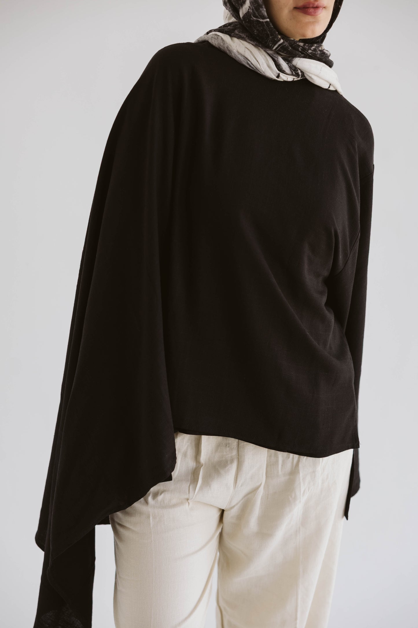 Minimalist Black Asymmetrical Cape Top